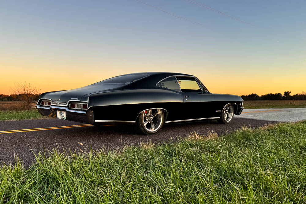 Rear three-quarter view of the Impala SS, capturing the aggressive stance and wide rear tires. Rear three-quarter view of the Impala SS, capturing the aggressive stance and wide rear tires.