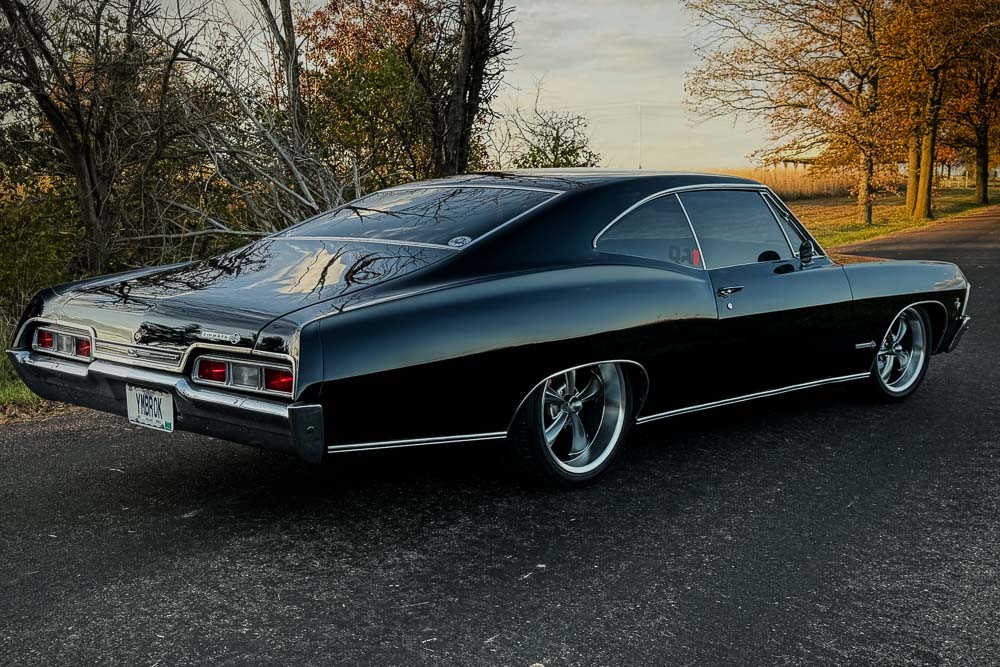 Custom black Spies Hecker paint job on the 1967 Impala SS, glowing under sunlight. Custom black Spies Hecker paint job on the 1967 Impala SS, glowing under sunlight.