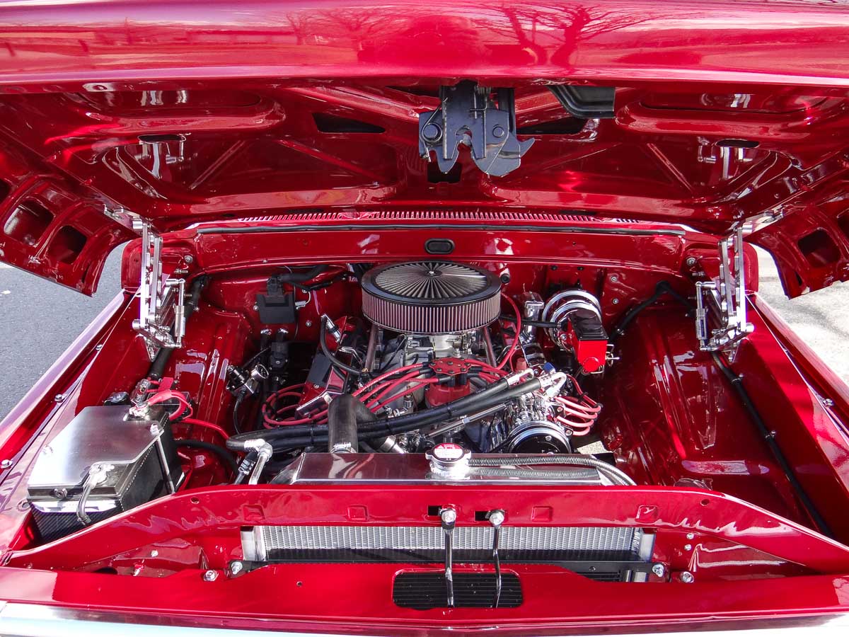 Close-up of the Ford FE 449 stroker engine in Ginger, featuring Edelbrock Pro-Flo 4 fuel injection and custom stainless steel exhaust. Close-up of the Ford FE 449 stroker engine in Ginger, featuring Edelbrock Pro-Flo 4 fuel injection and custom stainless steel exhaust.