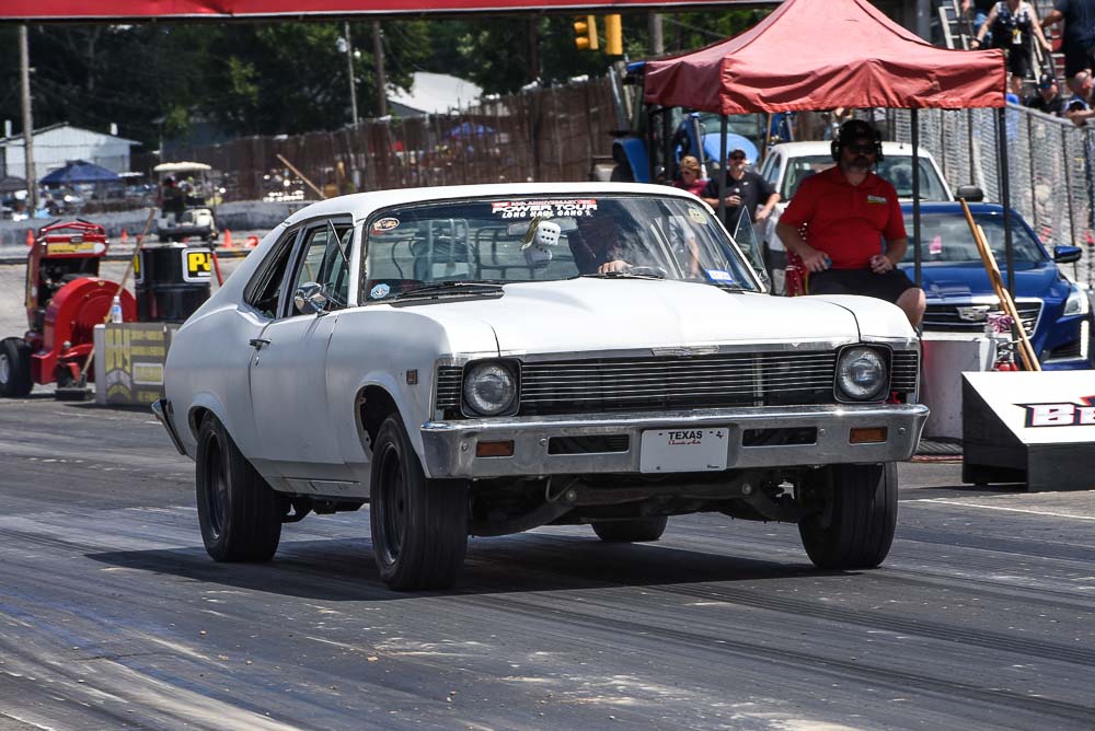 Owner reviewing options for Chevrolet Nova suspension upgrades, considering factors like budget, performance, and handling goals. Owner reviewing options for Chevrolet Nova suspension upgrades, considering factors like budget, performance, and handling goals.